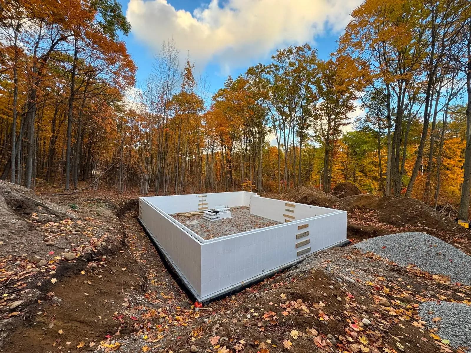 ICF home foundation under construction on a wooded property in Barrie, Ontario