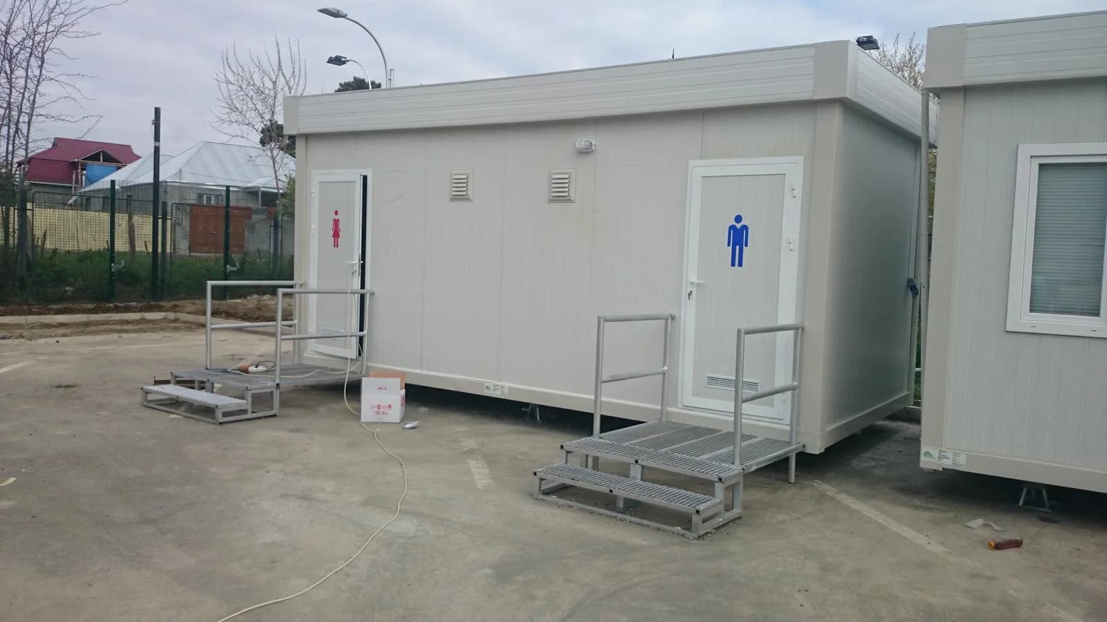 Male and female modular washroom entrances at a competition site