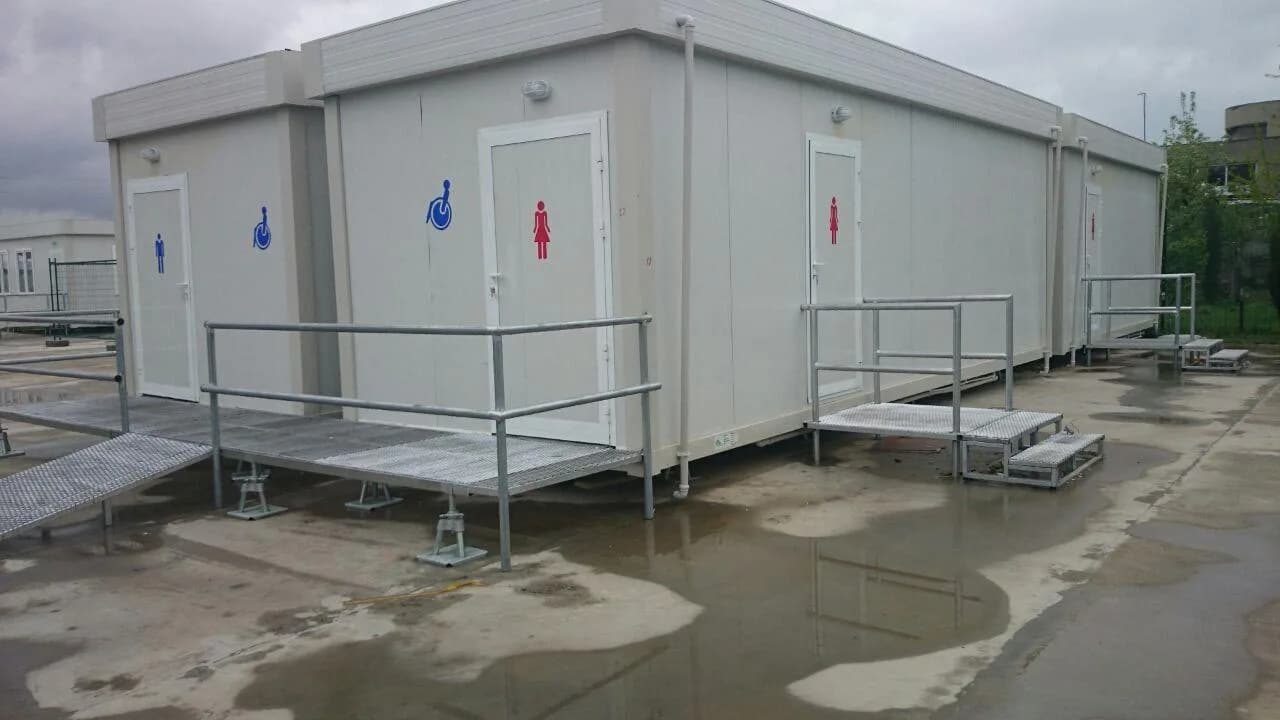 Portable washroom units with accessible entrance and galvanized railings