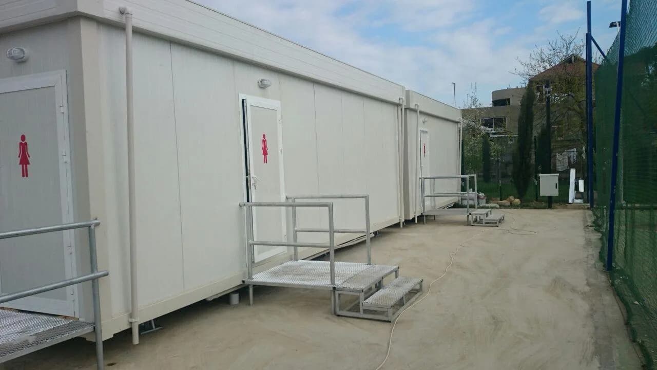 Toilet cubicles inside a temporary modular event washroom