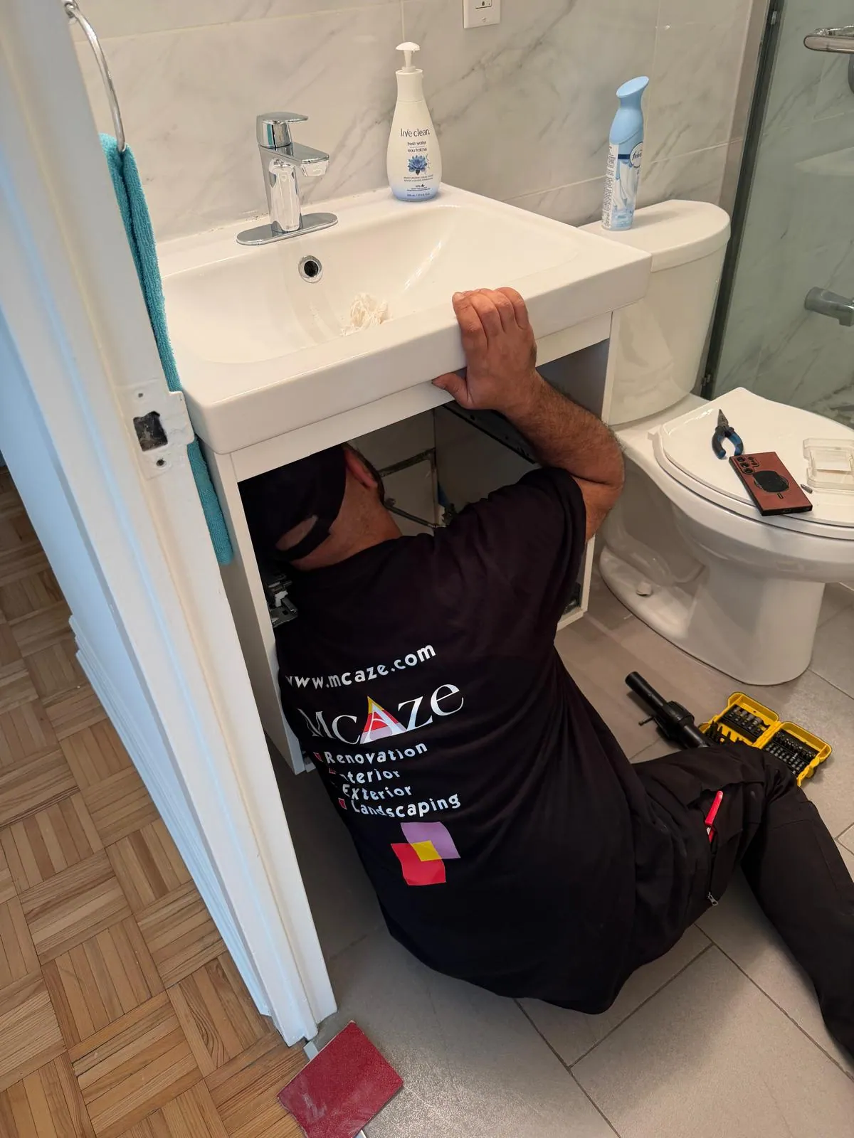 Bathroom vanity final connection in renovated North York condo