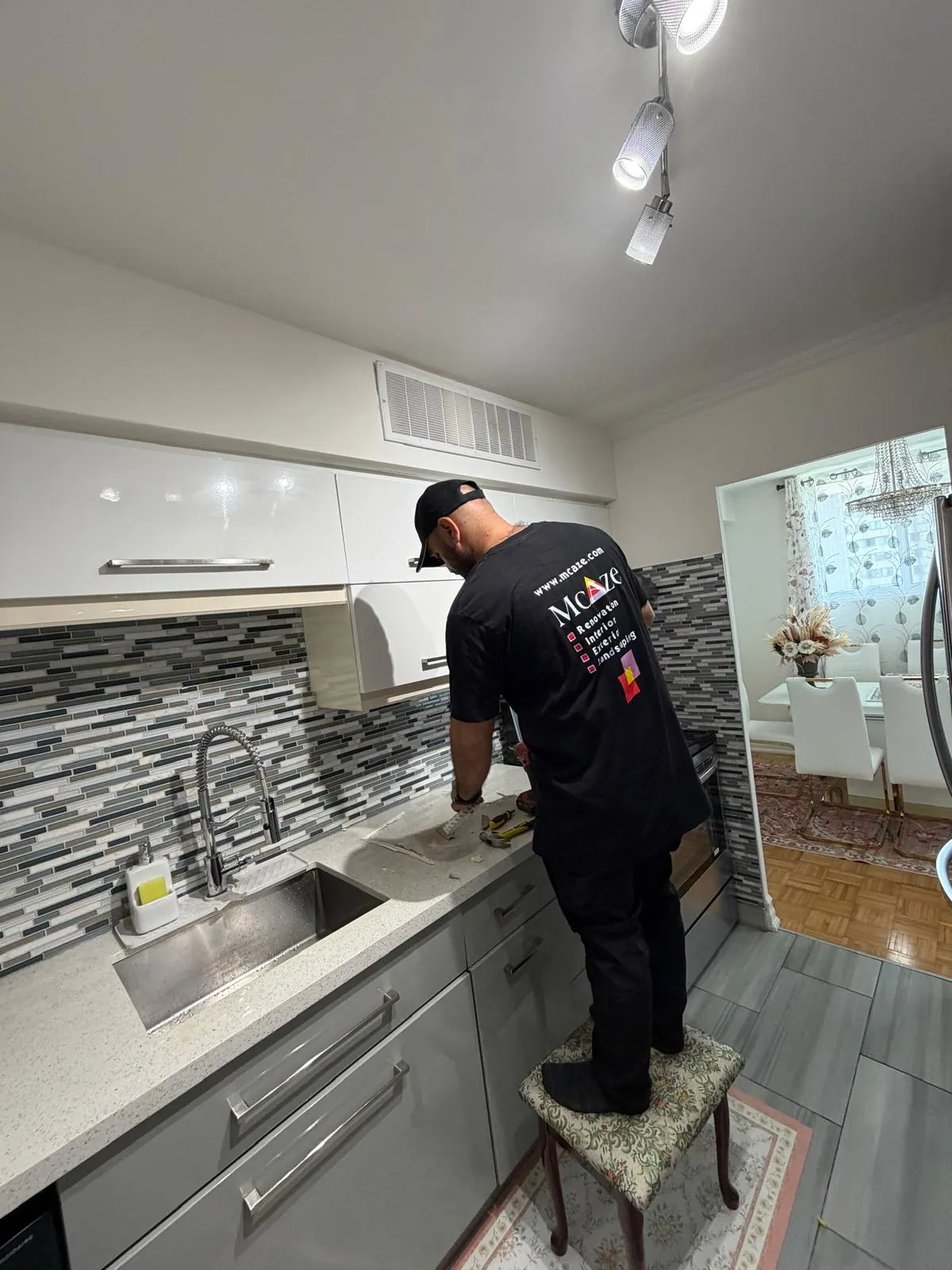 Final finishing work in a renovated North York condo kitchen