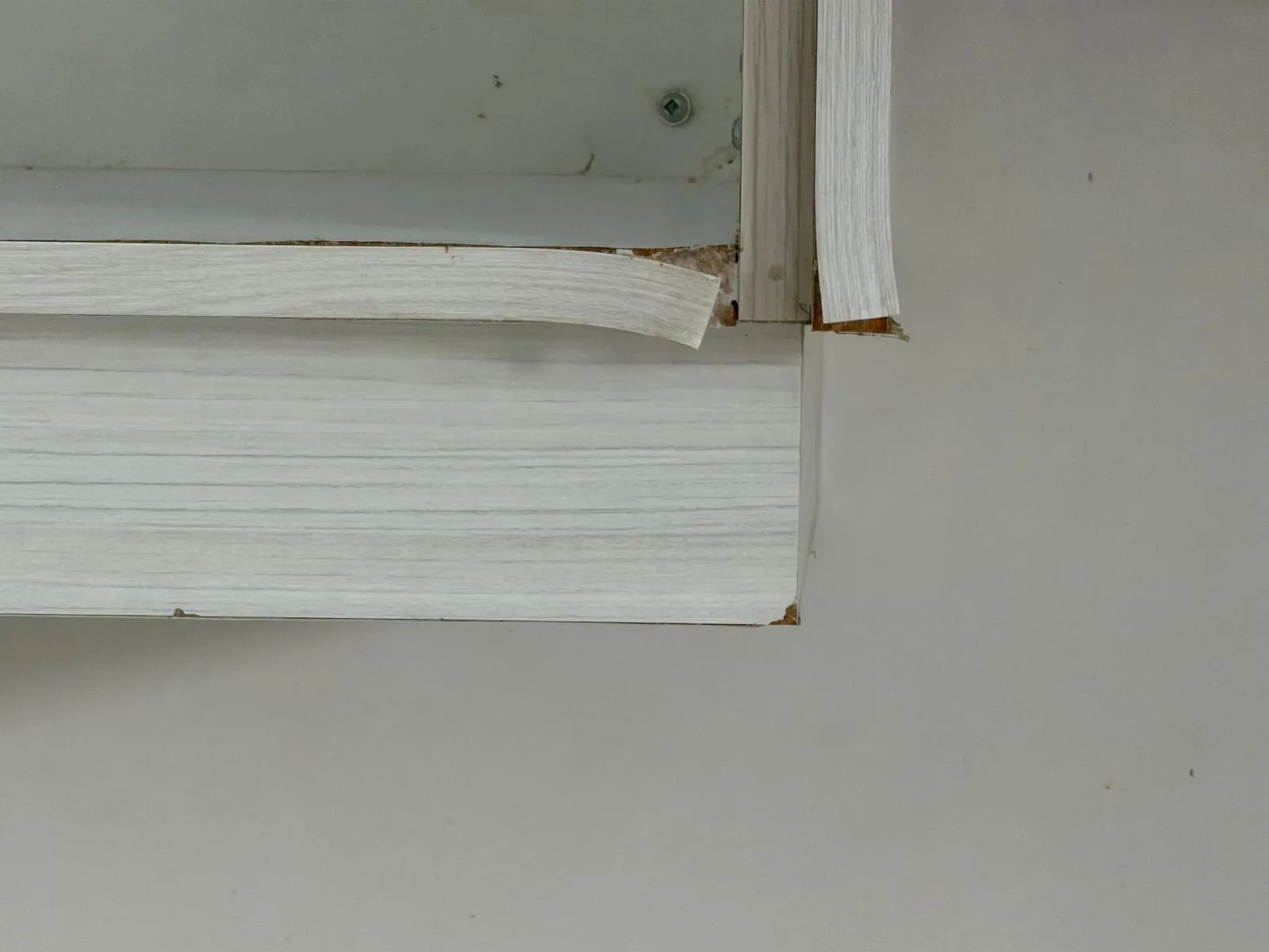 Damaged kitchen cabinet finish before repair in Thornhill