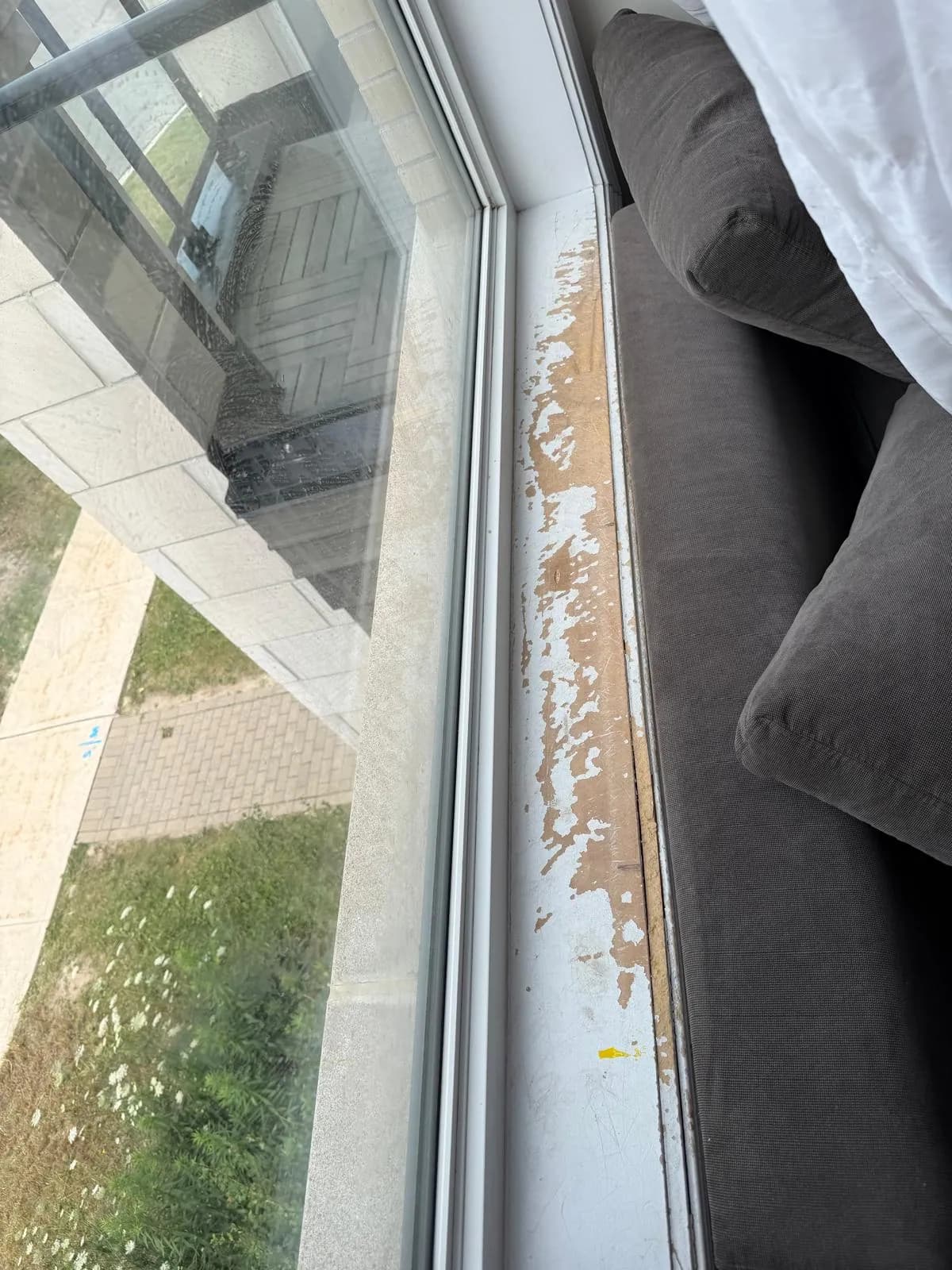 Damaged interior window sill before repair in Thornhill