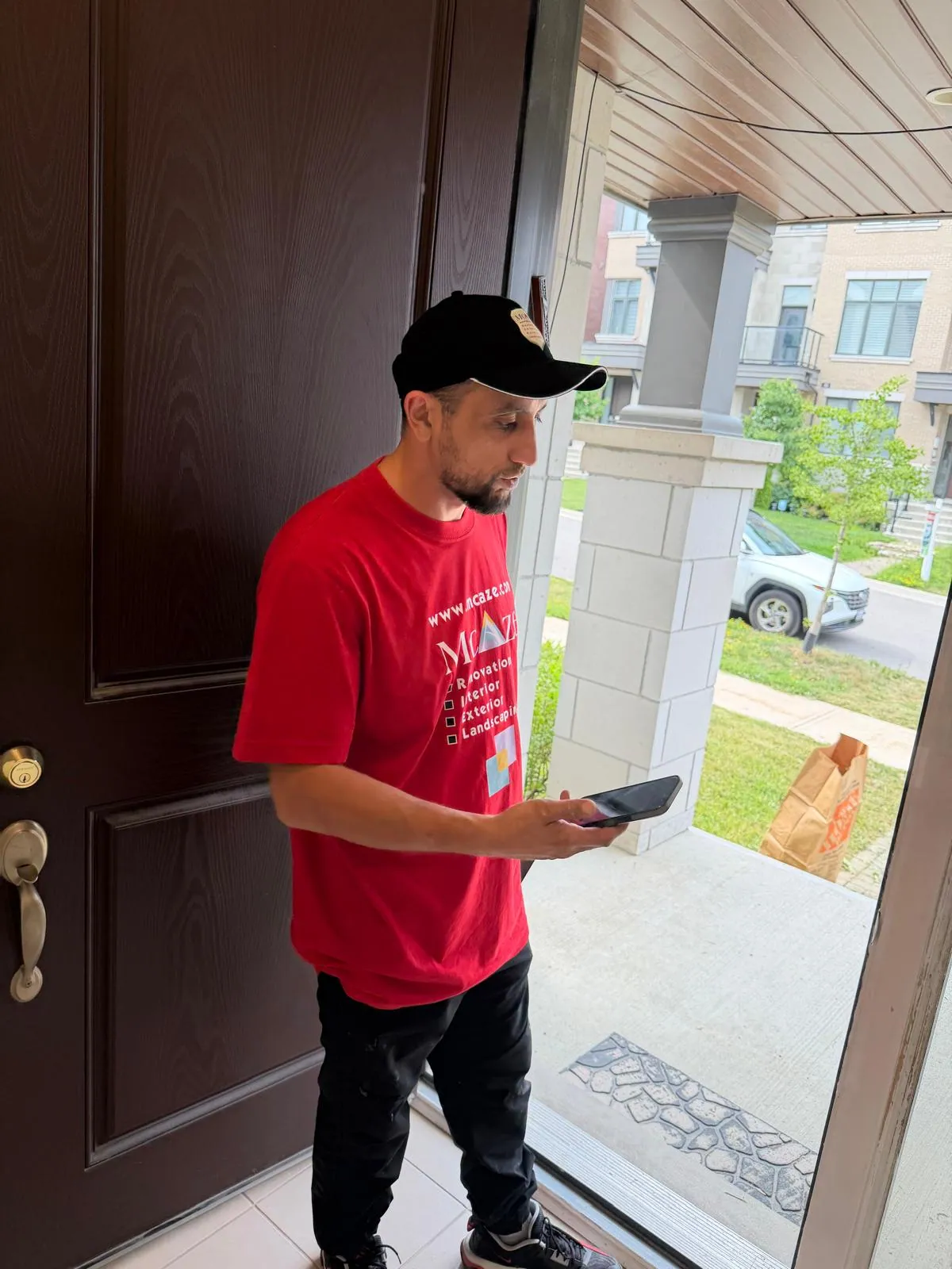McAze contractor assessing door repair in a Thornhill townhouse