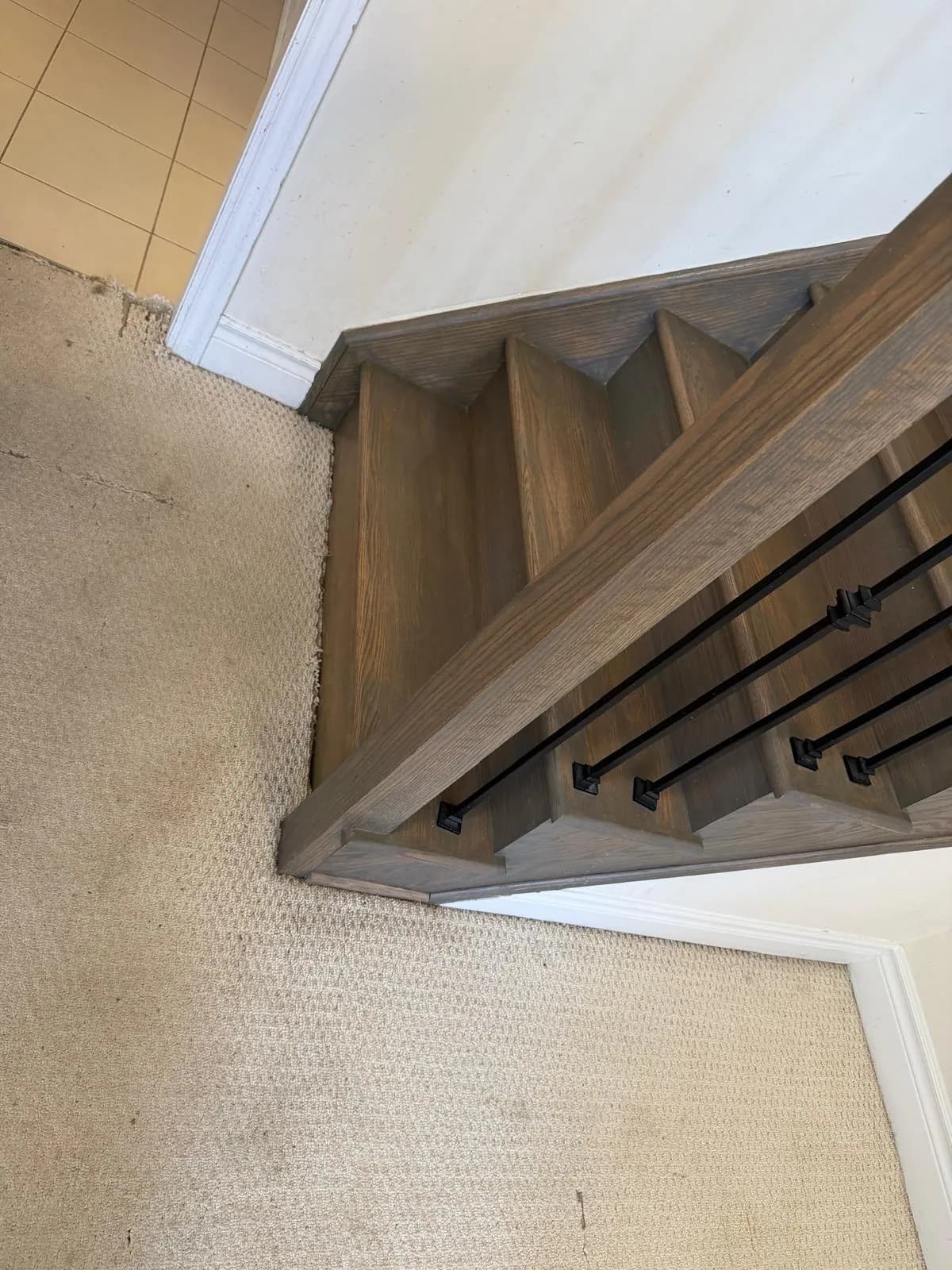 Hardwood staircase before refinishing in a Thornhill townhouse