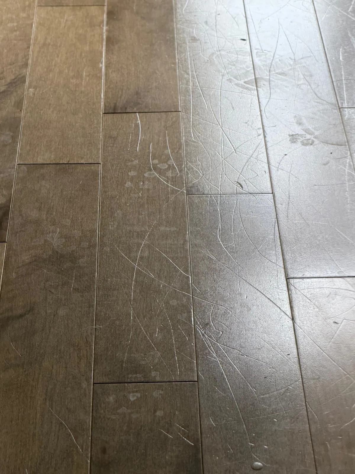 Scratched hardwood floor before sanding and refinishing in Thornhill