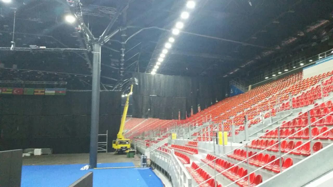 Completed temporary competition grandstand with red spectator seats inside a Toronto venue