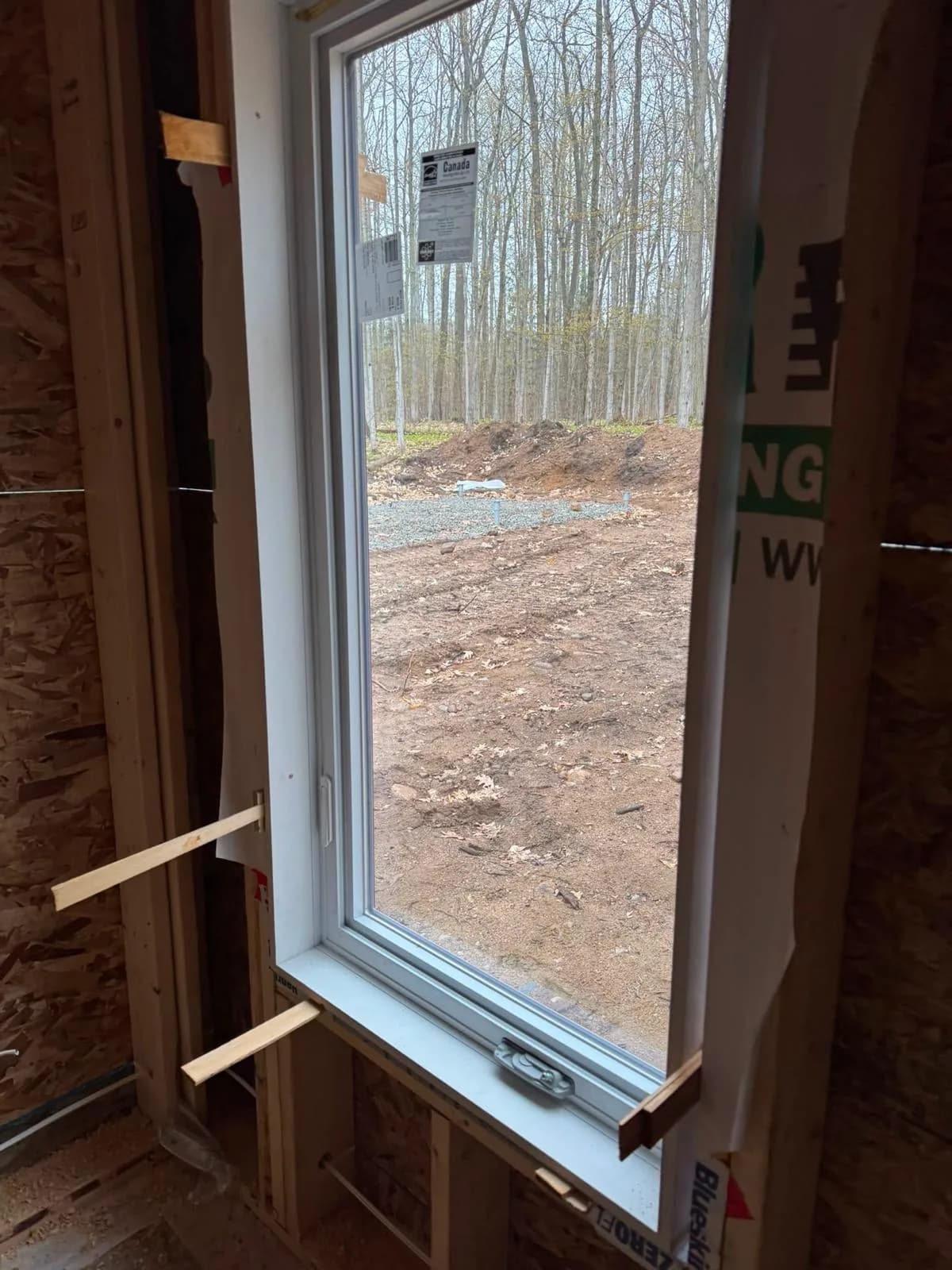Markham window installation with temporary wood supports for precise alignment