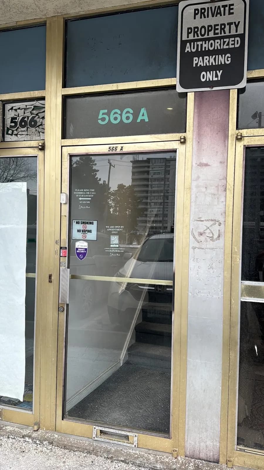 Existing worn commercial glass entrance door in Mississauga before replacement