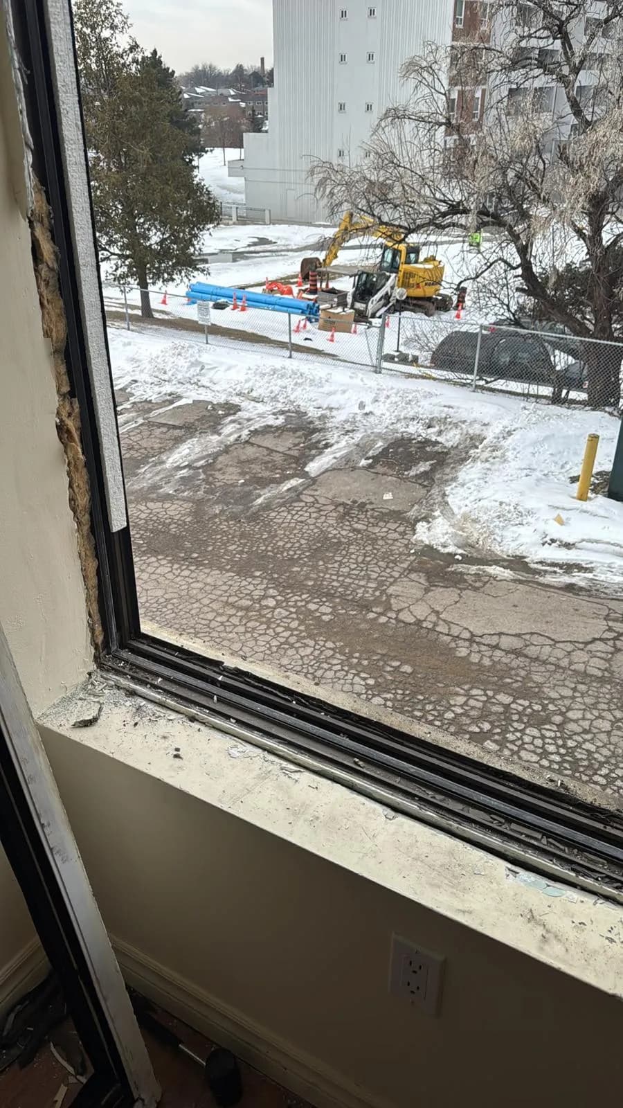 Old commercial window frame removed during Mississauga renovation
