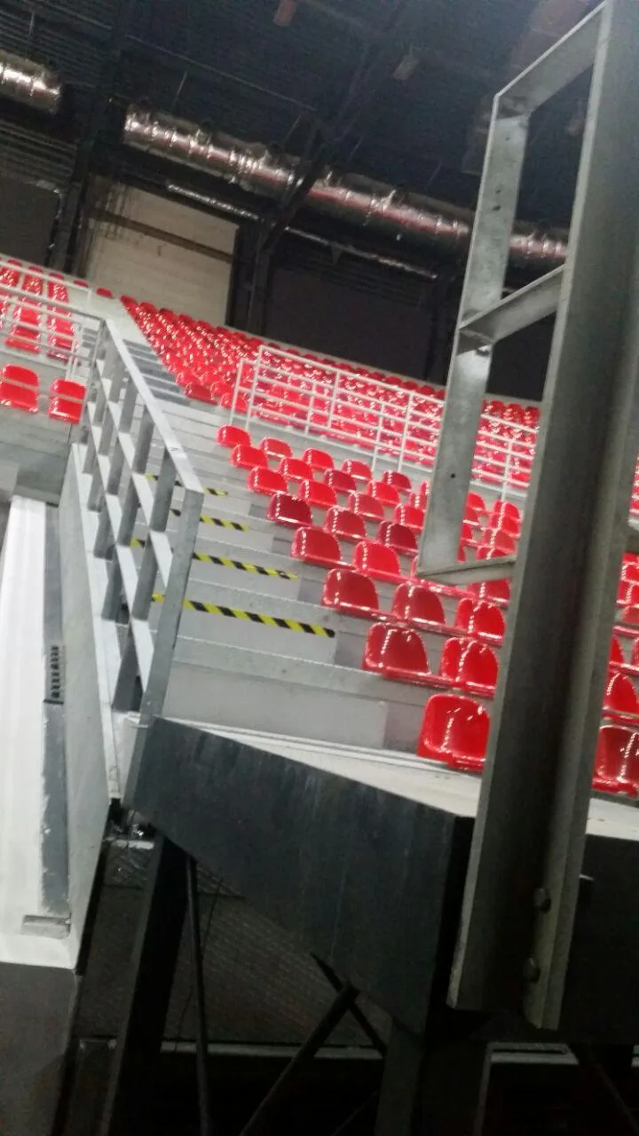 Temporary grandstand structural frame, stairs and guardrails inside an arena