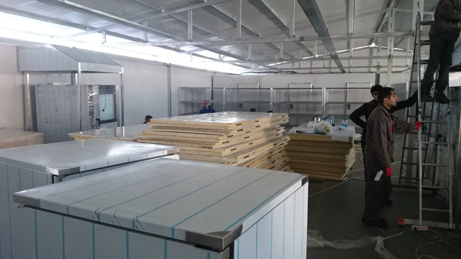 Insulated sandwich panels and food service equipment during restaurant fit-out